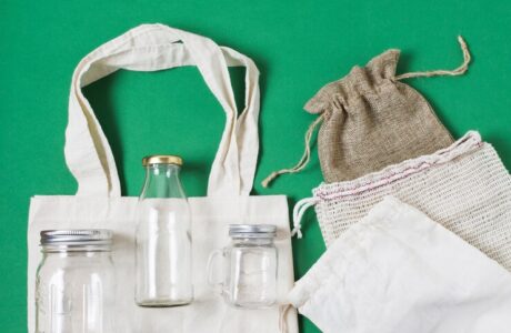 flat-lay-different-zero-waste-products-green-background_- sustainable corporate gifts