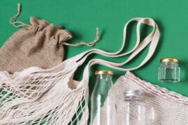 top-view-different-zero-waste-products-green-background_- corporate promotional gifts