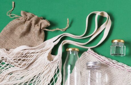 top-view-different-zero-waste-products-green-background_- corporate promotional gifts