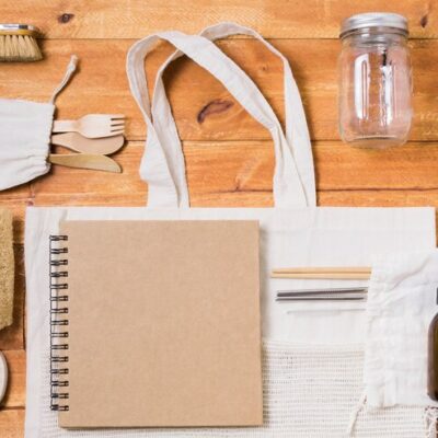 zero-waste-assortment-wooden-background_- ecofriendly promotional gifts dubai