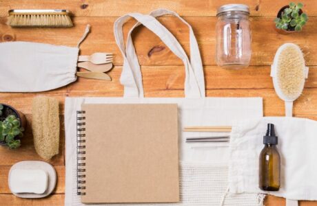 zero-waste-assortment-wooden-background_- ecofriendly promotional gifts dubai