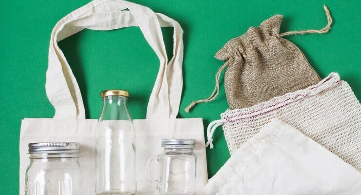 flat-lay-different-zero-waste-products-green-background_- sustainable corporate gifts