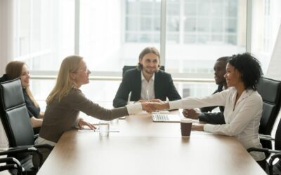 diverse-smiling-businesswomen-shaking-hands-greeting-multiracial-group-meeting_- CORPORATE GIFTS UAE