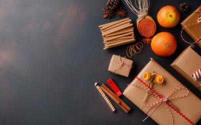 flat-lay-rustic-holiday-gift-wrapping-supplies-including-brown-paper-twine-dried-oranges-candles-fresh-oranges-dark-surface_-gifts for corporate events