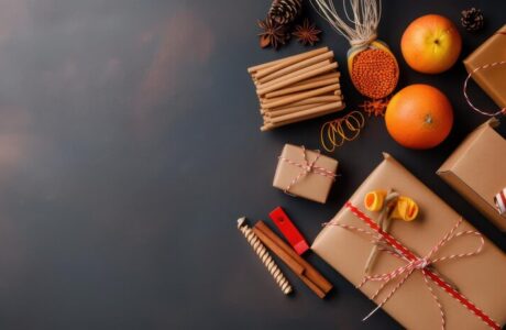flat-lay-rustic-holiday-gift-wrapping-supplies-including-brown-paper-twine-dried-oranges-candles-fresh-oranges-dark-surface_-gifts for corporate events