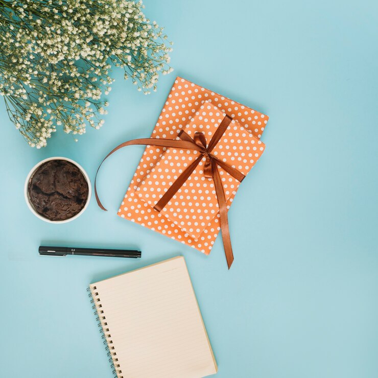 notepad-gift-near-cupcake-bouquet_- corporate gift ideas