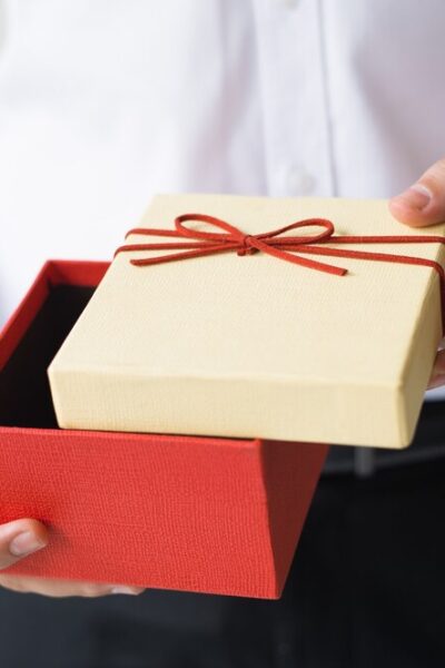 closeup-business-man-opening-gift-box_-
