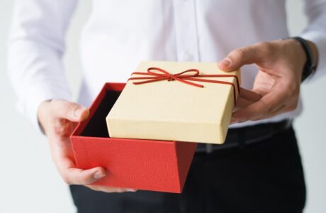 closeup-business-man-opening-gift-box_-