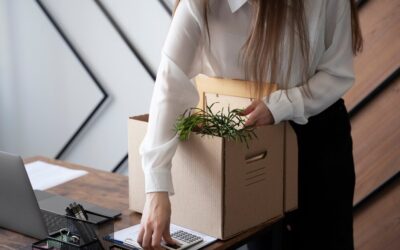 high-angle-woman-with-cardboard-box_-