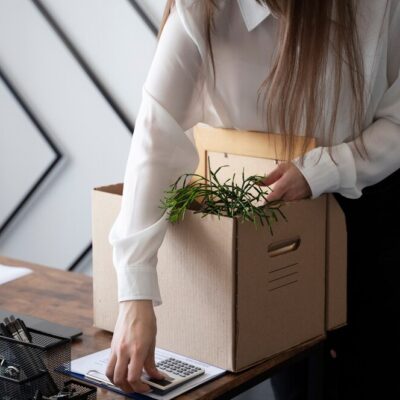 high-angle-woman-with-cardboard-box_-