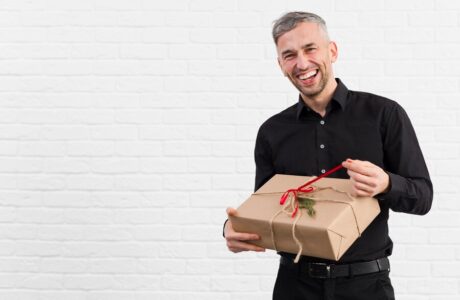 man-black-suit-unwrapping-gift-smiles_-
