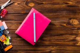 pen-notebook-near-stationery_-