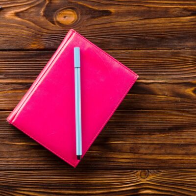 pen-notebook-near-stationery_-