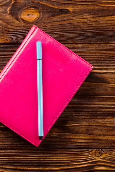 pen-notebook-near-stationery_-