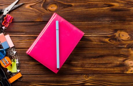 pen-notebook-near-stationery_-