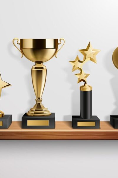 realistic-shiny-golden-trophy-awards-wooden-shelf-grey-background-vector-illustration_-