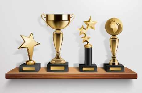 realistic-shiny-golden-trophy-awards-wooden-shelf-grey-background-vector-illustration_-