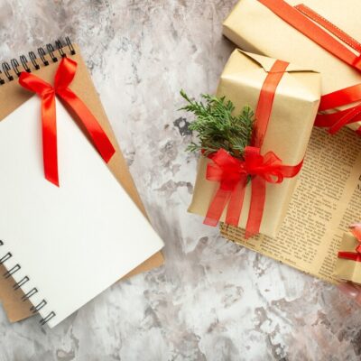 top-view-christmas-presents-with-red-bows-white-background_-