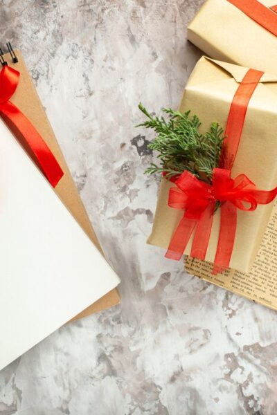 top-view-christmas-presents-with-red-bows-white-background_-