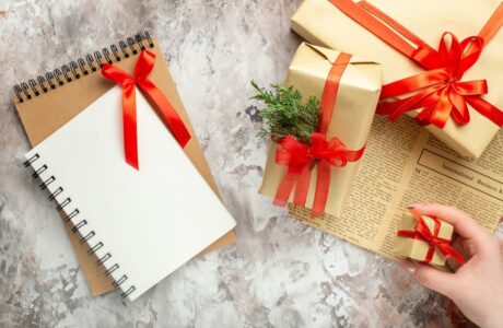 top-view-christmas-presents-with-red-bows-white-background_-