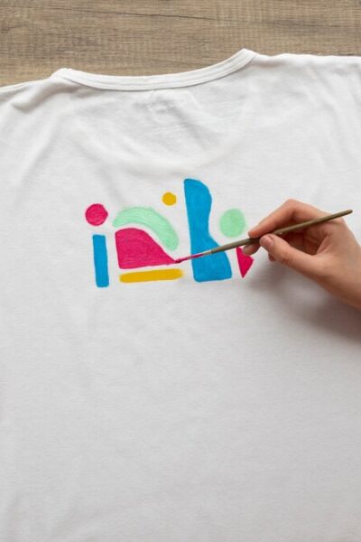 top-view-hands-painting-t-shirt-still-life_-