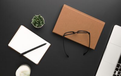 top-view-workspace-with-glasses-laptop_-