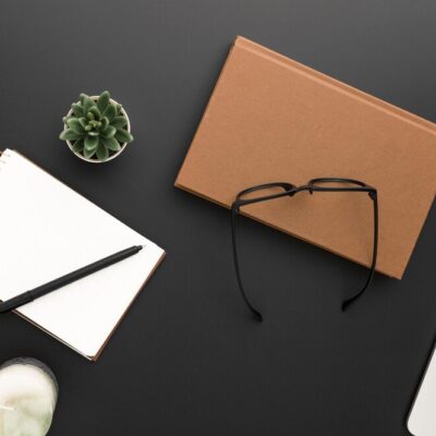 top-view-workspace-with-glasses-laptop_-