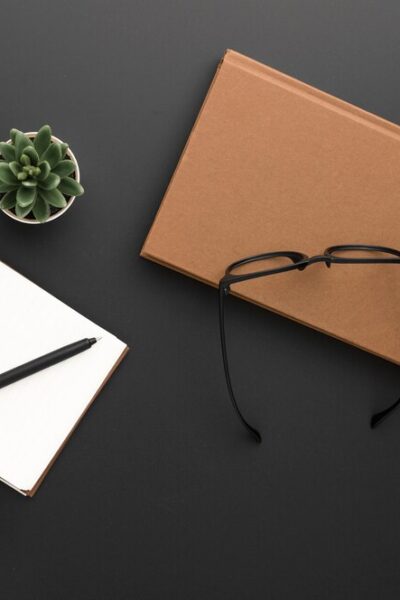 top-view-workspace-with-glasses-laptop_-