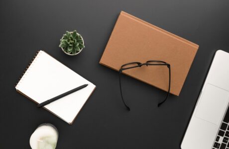 top-view-workspace-with-glasses-laptop_-