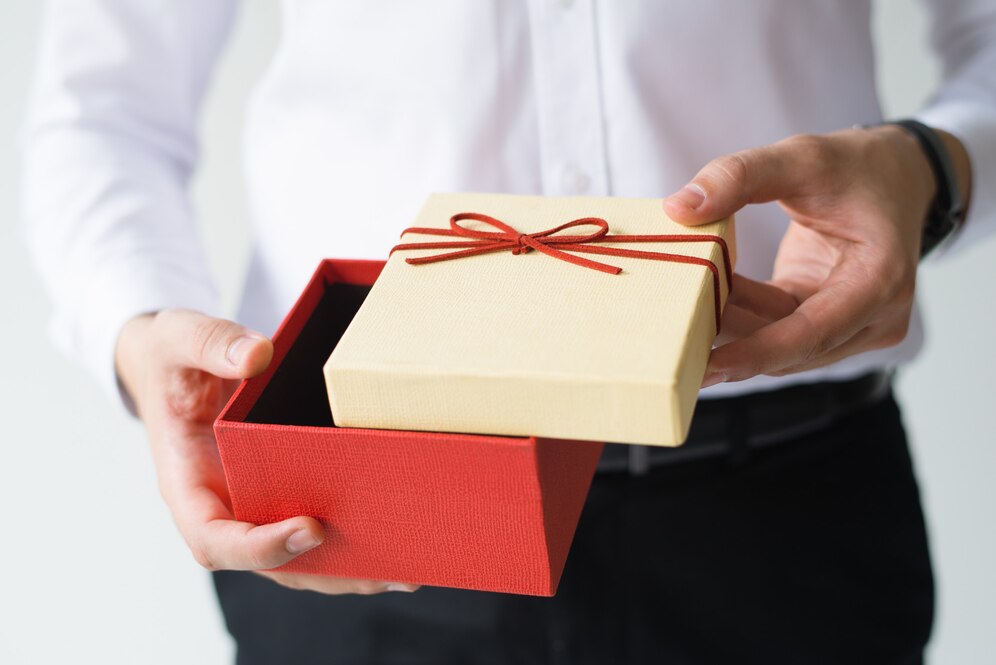 closeup-business-man-opening-gift-box_-