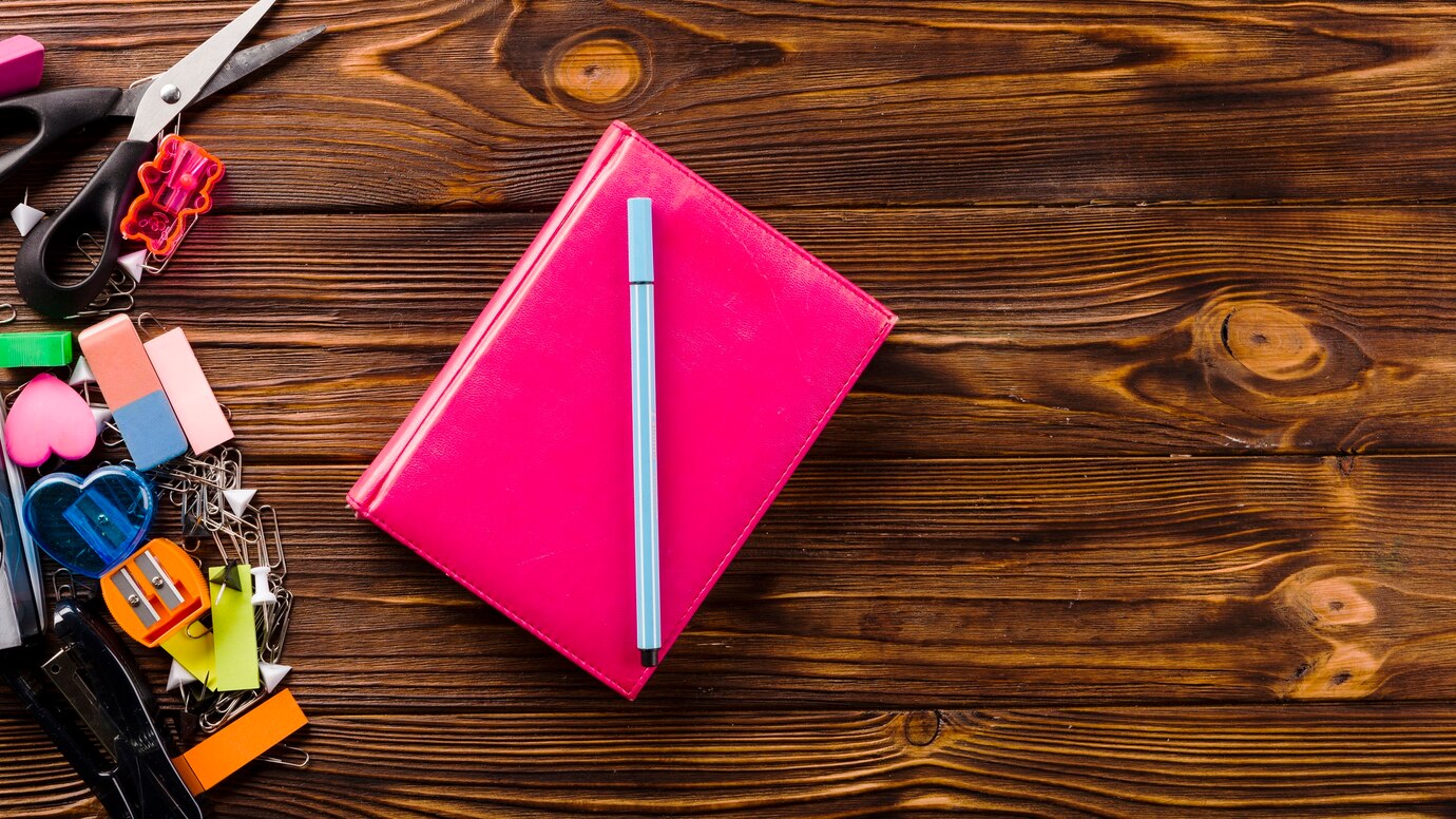 pen-notebook-near-stationery_-