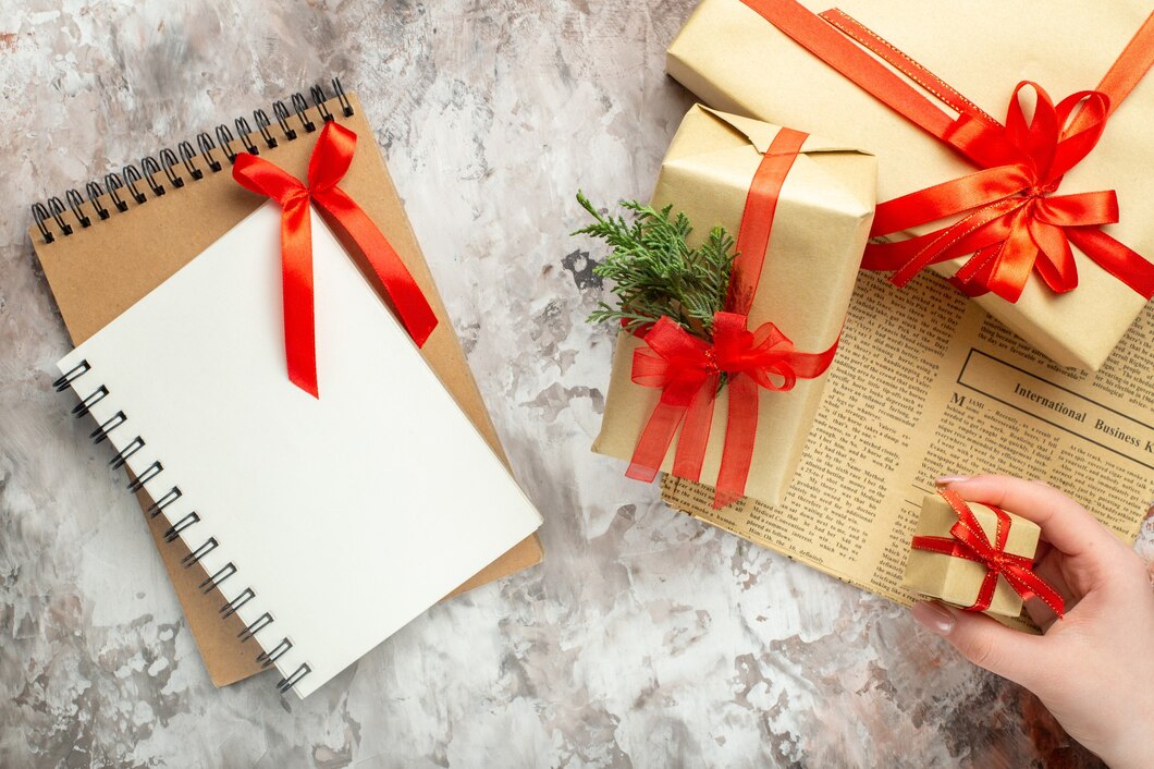 top-view-christmas-presents-with-red-bows-white-background_-